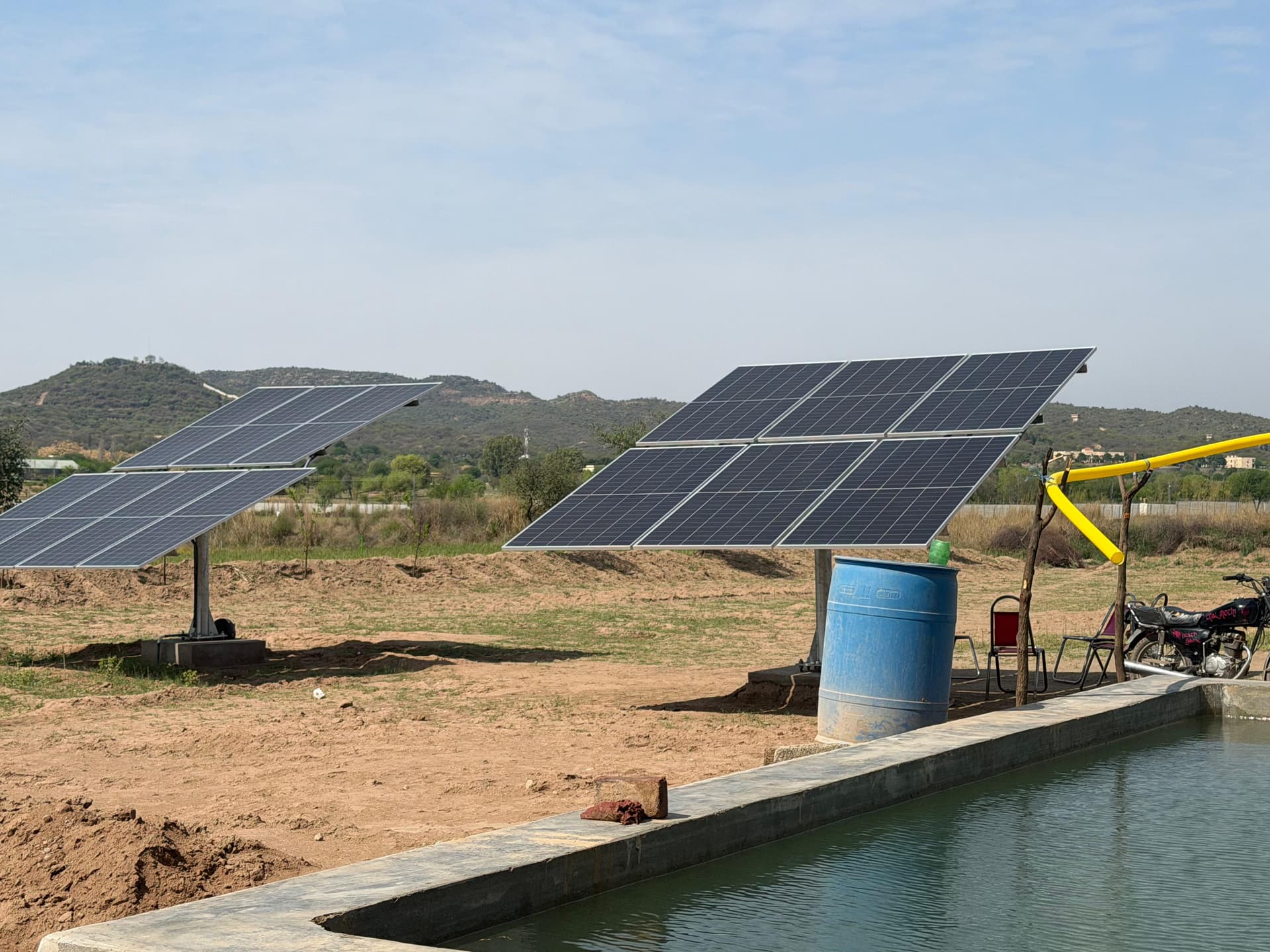 Solar panels powering agricultural water pump system in Pakistan
