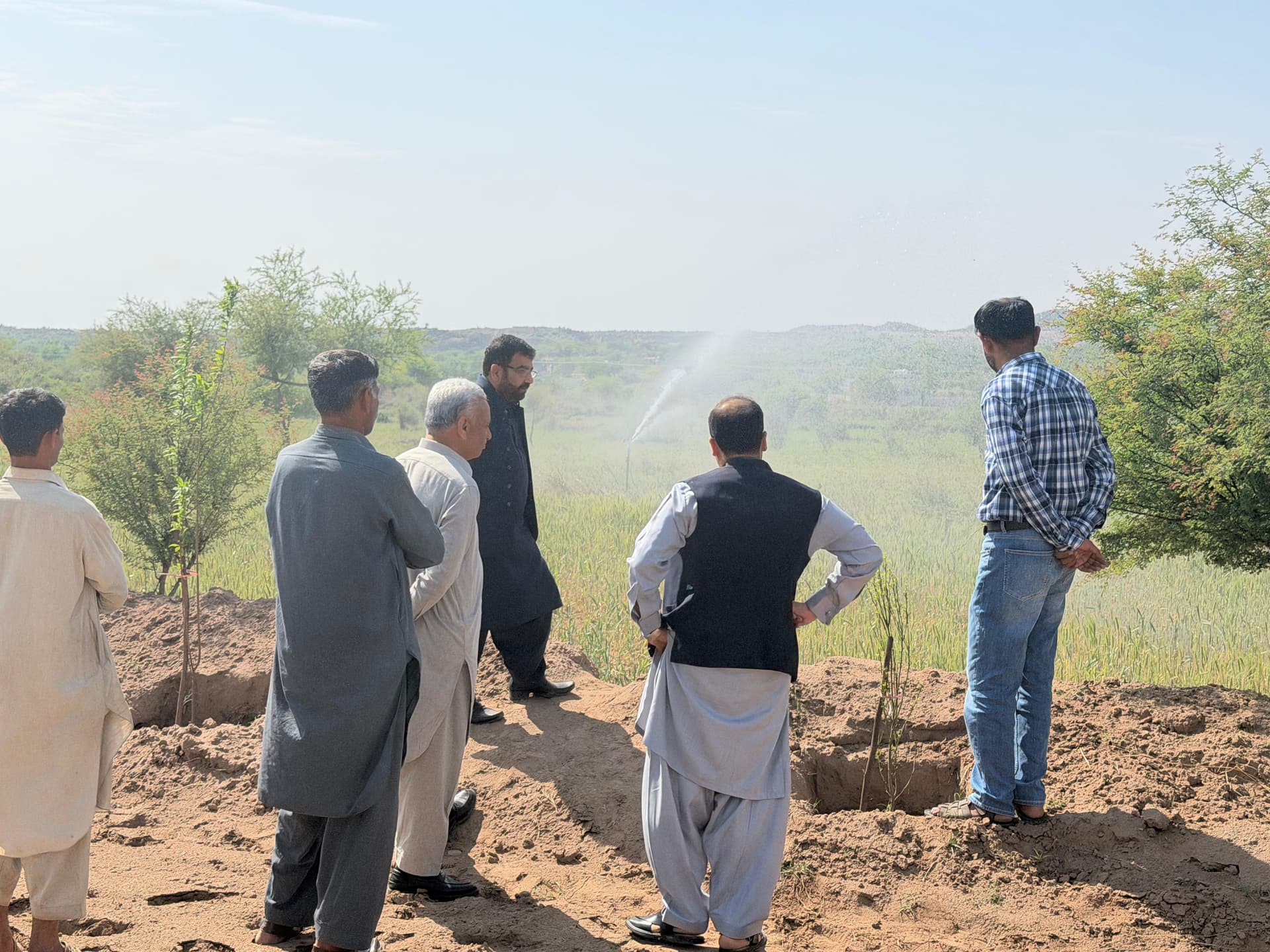 Hydro Leaf Engineering team conducting site inspection for orchard project in Pakistan